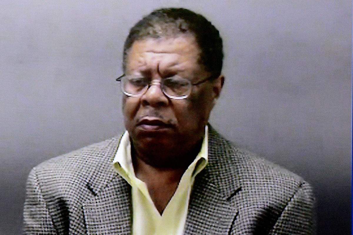 Ingham County prosecutor Stuart Dunnings III, shown handcuffed at the Ingham County jail on video, appears for an arraignment at a courtroom in Lansing, Mich., Monday, March 14, 2016. 