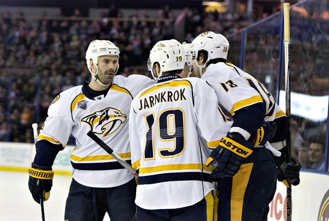 Nashville Predators celebrate a goal against the Edmonton Oilers during first period NHL action in Edmonton, Alta., on Monday March 14, 2016. 