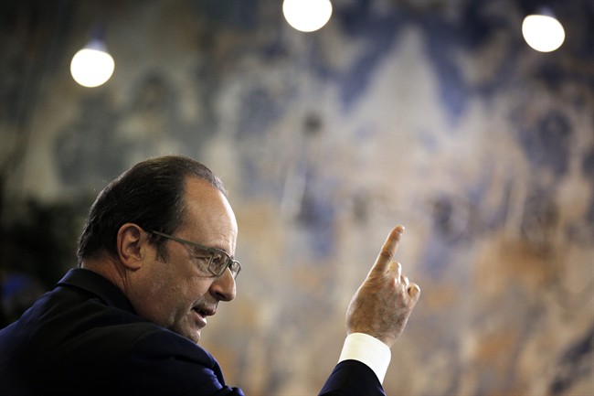 Two people were injured after a French police sharpshooter accidentally fired during a speech by President Francois Hollande.