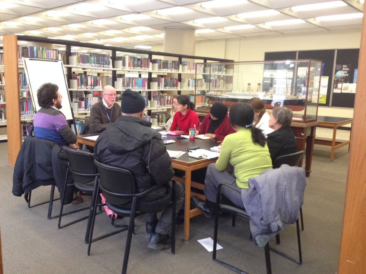 Newcomers take part in an English conversation class at the Stanley A. Milner library downtown.