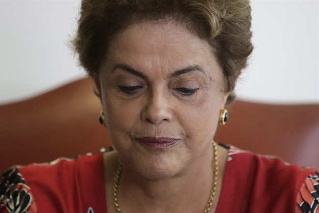 Brazil's largest party abandoned President Dilma Rousseff's governing coalition Tuesday, making it tougher for her to survive mounting pressure in Congress for her impeachment.
