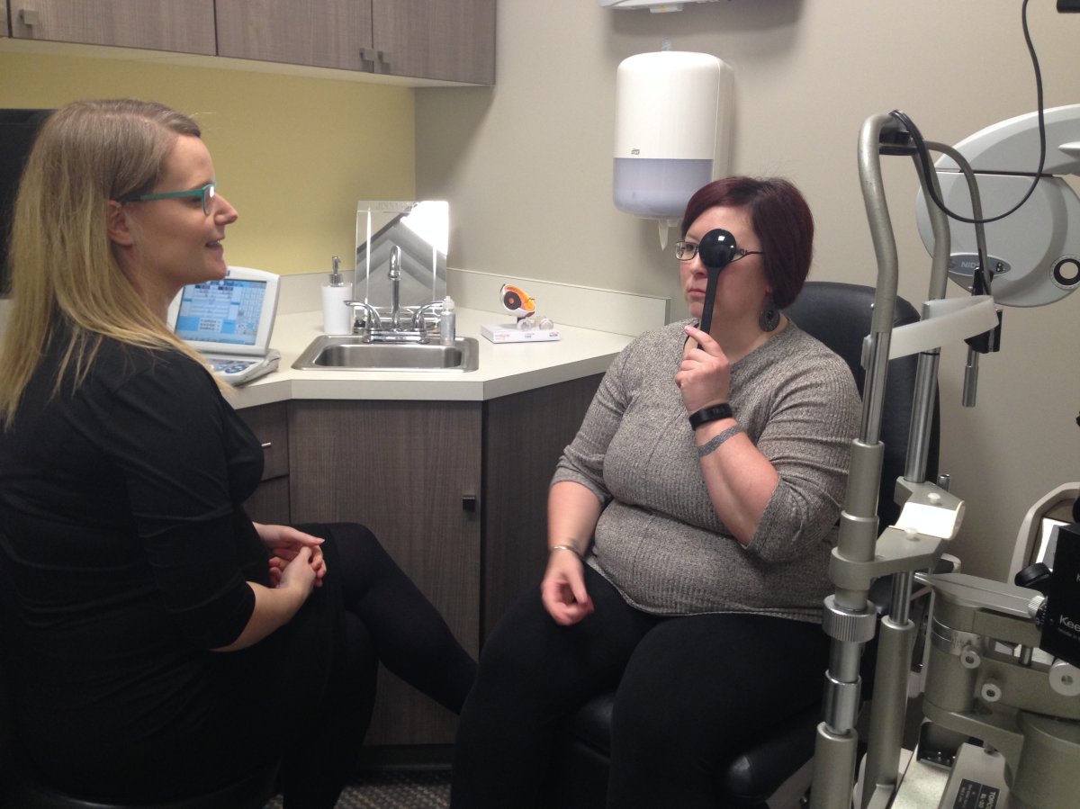Donna McRae gets an eye exam from optometrist Dr. Sarah Keep. 