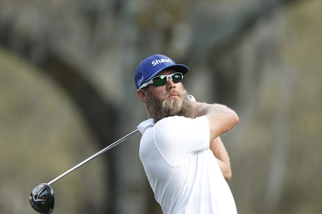 Graham DeLaet, of Canada, hits his tee shot on the 14th hole during the third round of the Valspar Championship golf tournament Saturday, March 12, 2016, in Palm Harbor, Fla.