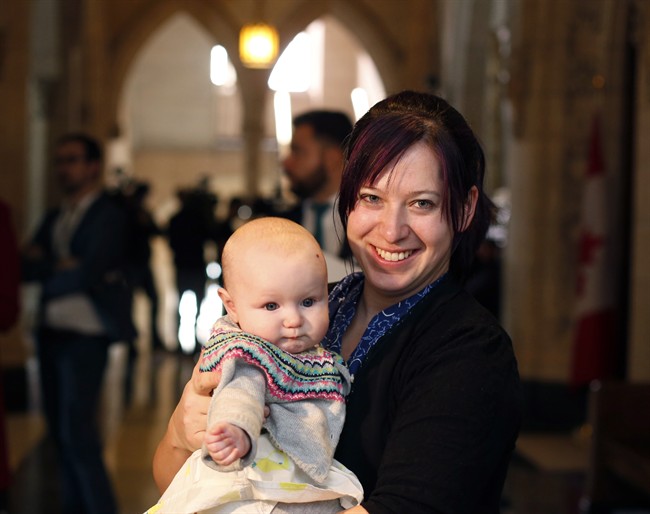 NDP MP Christine Moore holds her daughter Daphnee.