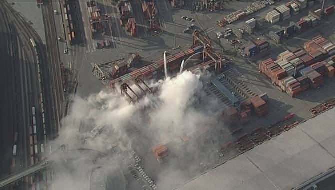 A container fire burns at the Port of Metro Vancouver on March 5, 2016. 