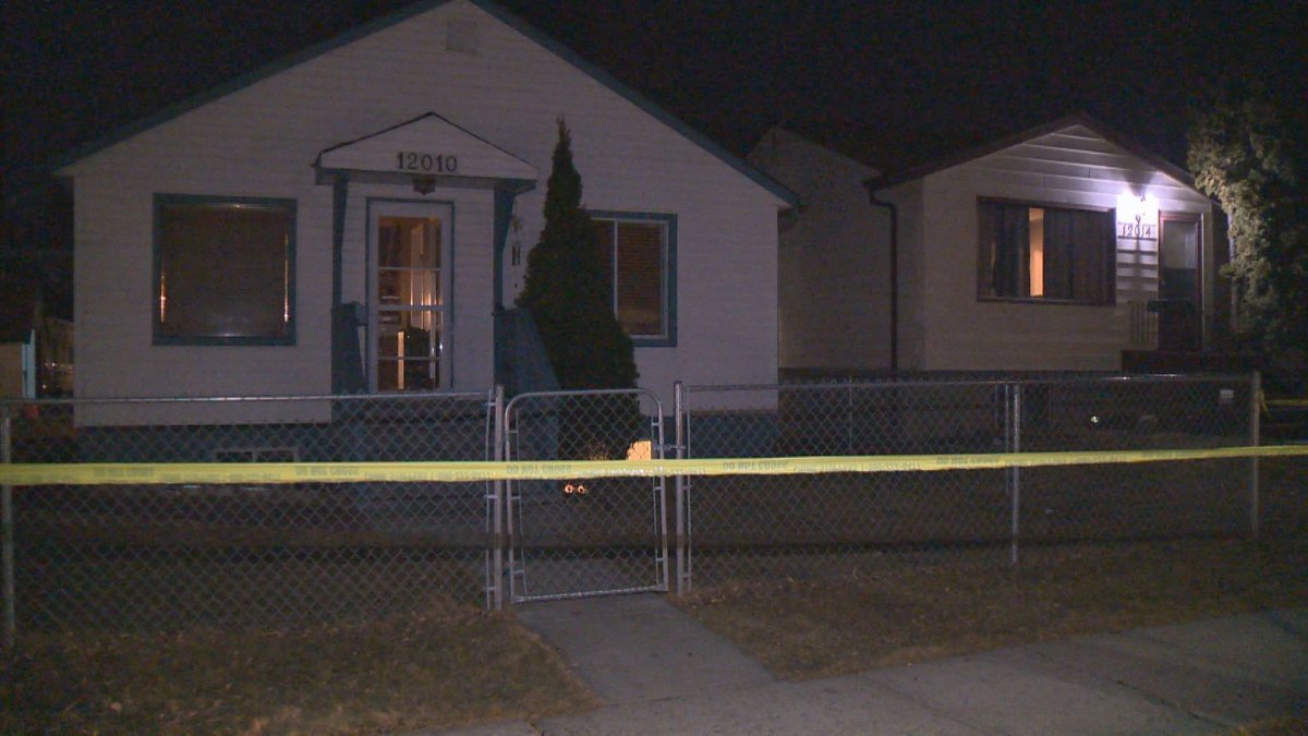 Police tape surrounds a home in NE Edmonton where officers investigate reports of shots being fired.