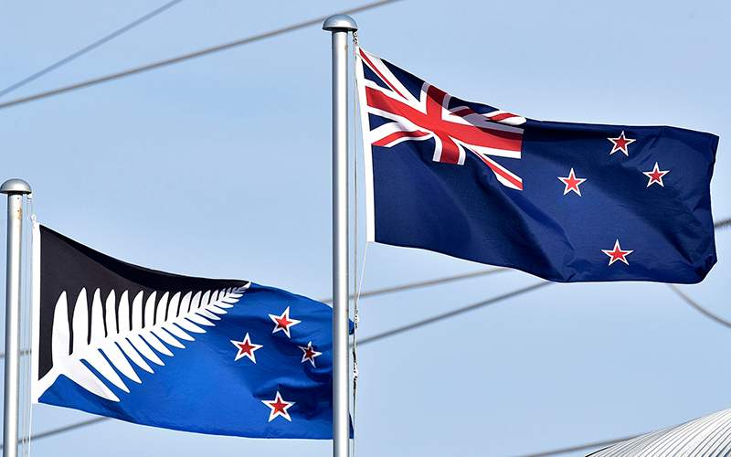 The current New Zealand flag (R) flutters next to the alternative flag (L) in Wellington on March 4, 2016.  