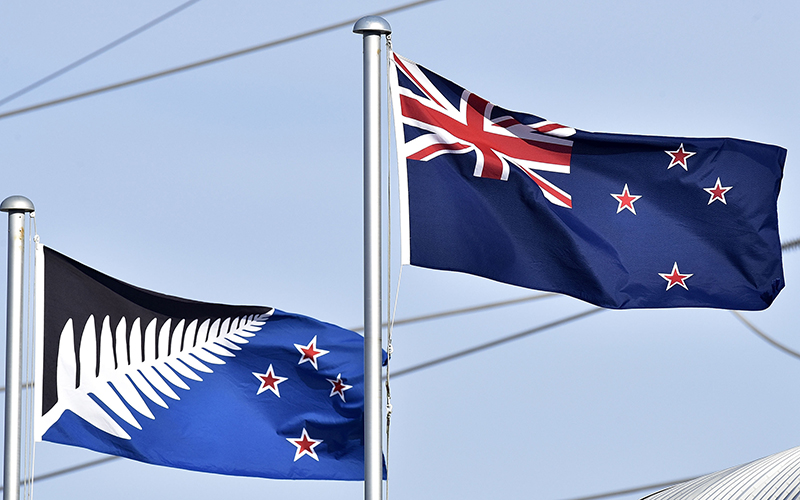 The current New Zealand flag (R) flutters next to the alternative flag (L) in Wellington on March 4, 2016.  