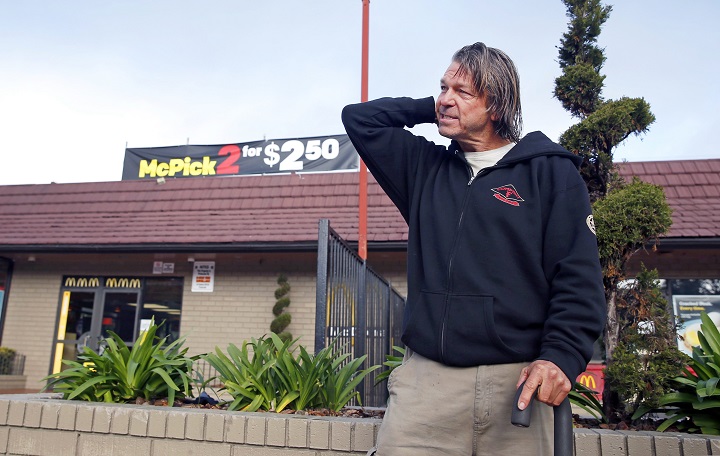 In this Feb. 2, 2016 file photo, Matthew Hay-Chapman returns to the McDonald's restaurant at Haight and Stanyan streets in San Francisco, to describe how he spotted two of the Orange County jail escapees that resulted in their capture. Hay-Chapman, a homeless man, and three other people will share $150,000 in reward money, with $100,000 going to Hay-Chapman. 