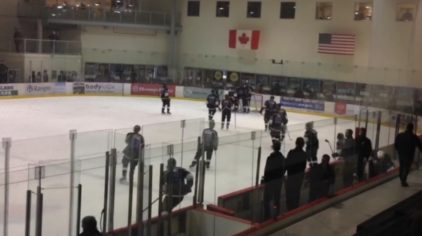 The Oak Park Raiders celebrate a Game 2 victory in the Winnipeg High School Hockey League championship series.