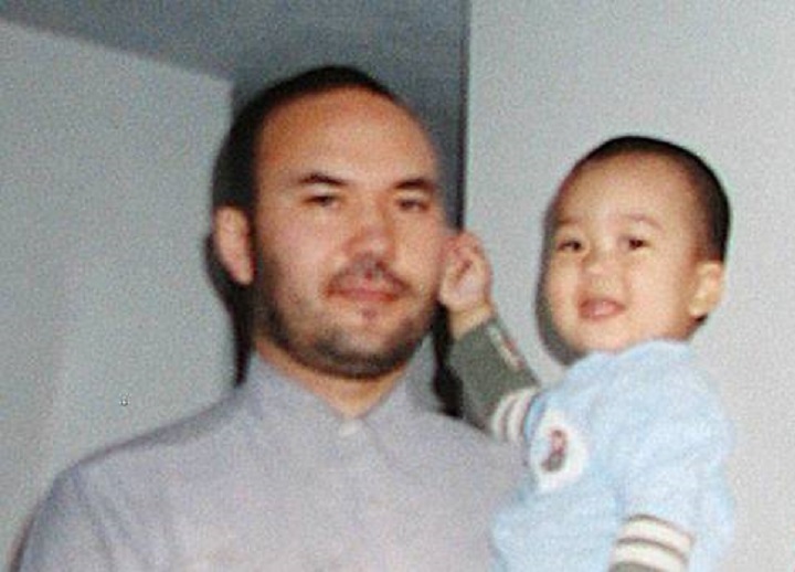 Huseyin Celil is seen in this undated family photo with his son prior to his incarceration.