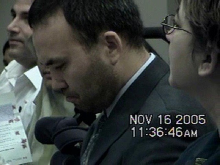 Huseyin Celil is seen in this still from a family video during his citizenship ceremony in 2005.