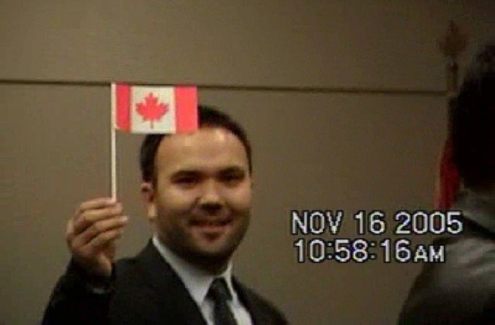 Huseyin Celil is seen in this still from a family video during a citizenship ceremony in 2005.