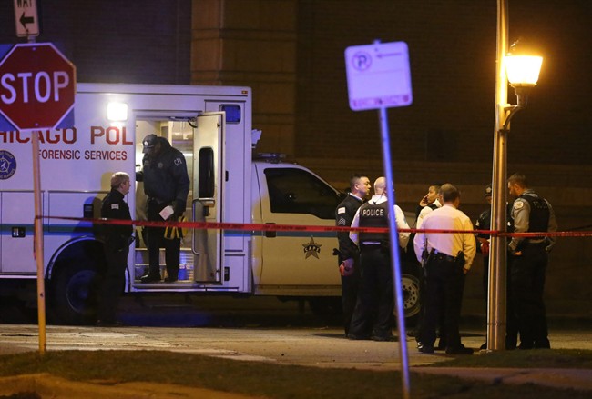 Chicago police officers on the scene where three officers were shot in the 3700 block of West Polk Street in the Homan Square neighbourhood of Chicago. 