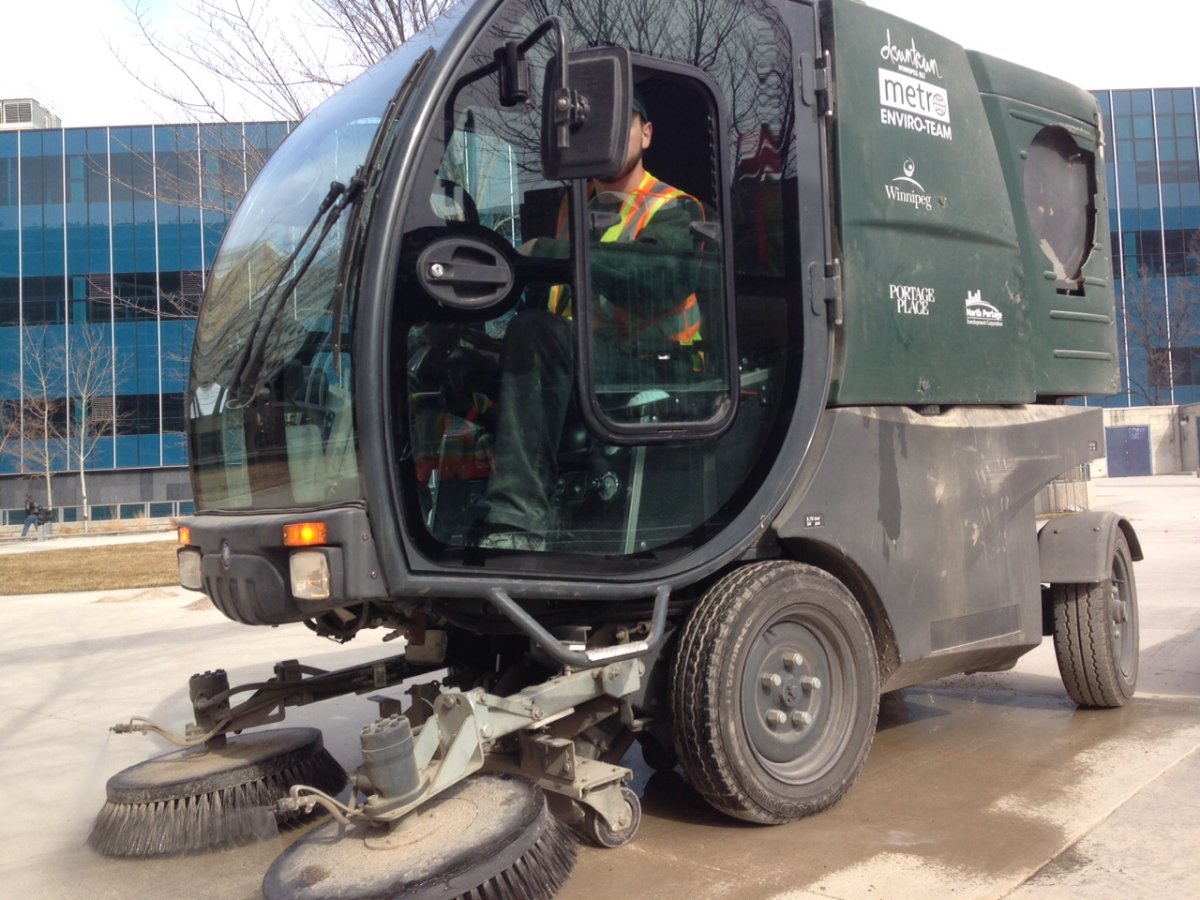 Enviro Team member drives one of their sweepers.