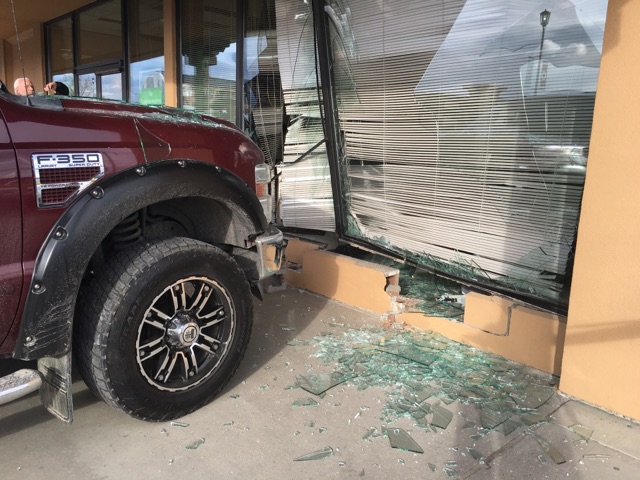 A pick up truck smashed into the window of a Kelowna bank on Tuesday afternoon. 