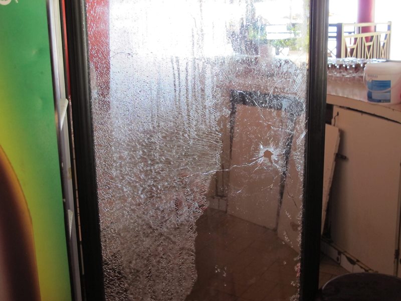 A bullet hole through the bar refrigerator door, at Etoile du Sud Hotel, that was involved in an beach attack in Grand Bassam, Ivory Coast, Tuesday, March 15, 2016. 