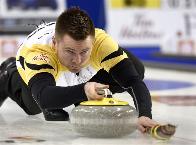 Manitoba skip Mike McEwen makes a shot during a draw against Ontario at the 2016 Tim Hortons Brier.