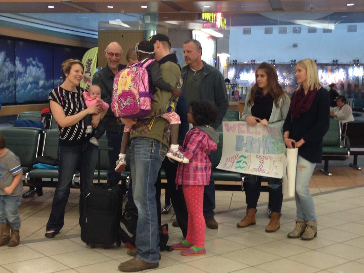 Father Kevin Maul holds his daughter Jolie for the first time.