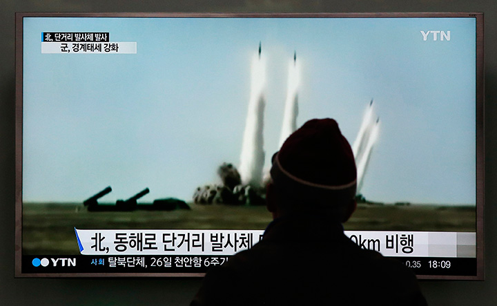 A man watches a TV screen showing file footage of a missile launch conducted by North Korea, at Seoul Railway Station in Seoul, South Korea, Monday, March 21, 2016. 