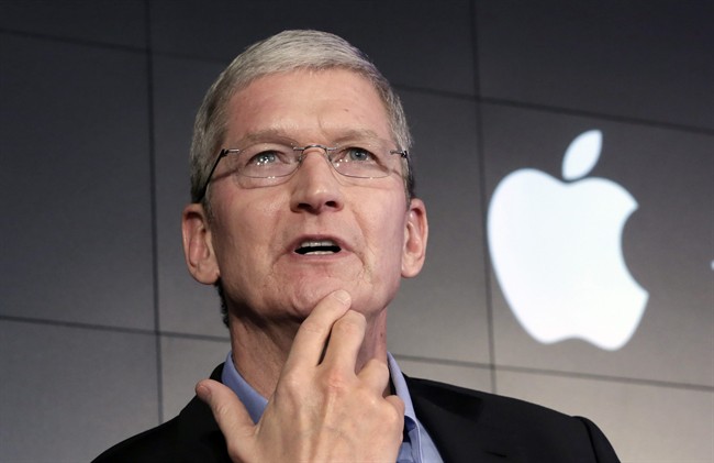 In this April 30, 2015 file photo, Apple CEO Tim Cook responds to a question during a news conference at IBM Watson headquarters, in New York. 