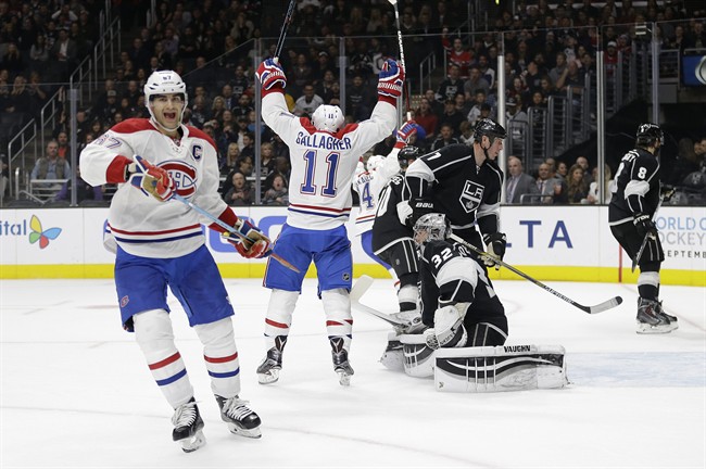 Montreal Canadiens' Max Pacioretty (67) and Brendan Gallagher(11) celebrate a goal by P.K. Subban in front of Los Angeles Kings goalie Jonathan Quick(32) during the first period of an NHL hockey game Thursday, March 3, 2016, in Los Angeles.