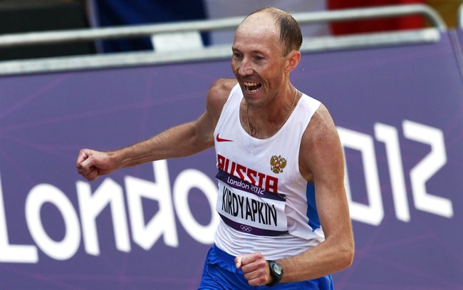 Sergei Kirdyapkin, of Russia, wins the gold medal in the men's 50-kilometer race walk at the 2012 Summer Olympics, in London.