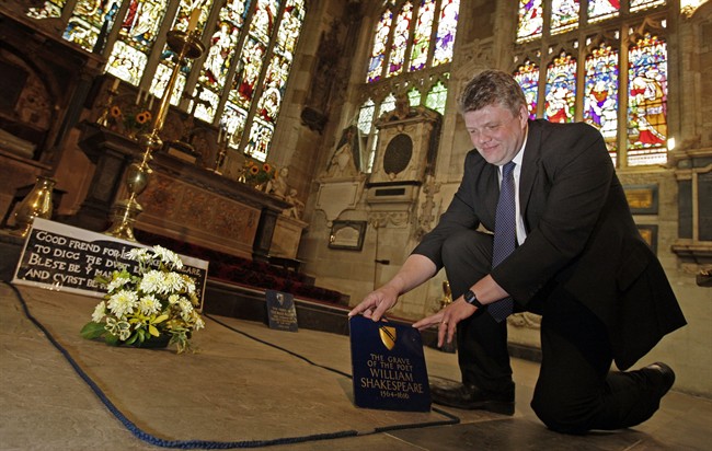 In this Monday, Sept. 21, 2009 file photo, Head Verger Jon Ormrod tends to the grave of William Shakespeare in the Chancel of Holy Trinity Church in Stratford Upon Avon, England. Archeologists who scanned the grave of William Shakespeare say they have made a startling discovery: His skull appears to be missing.