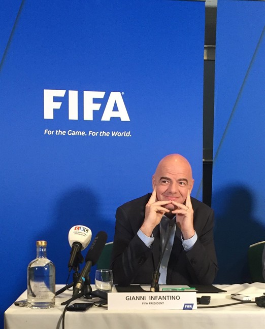 FIFA President, Gianni Infantino listens to a question during a press conference in Cardiff, Wales, Friday, March 4, 2016. The first week of Gianni Infantino's FIFA presidency is set to end with soccer further embracing technology once blocked by Sepp Blatter.