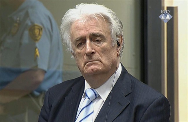In this image taken from video Bosnian Serb wartime leader Radovan Karadzic listens to the verdict at the International Criminal Tribunal for Former Yugoslavia (ICTY) in The Hague, The Netherlands Thursday March 24, 2016. Karadzic was convicted of genocide and nine other charges Thursday at a U.N. court, and sentenced to 40 years in prison. (ICTY, Pool via AP).