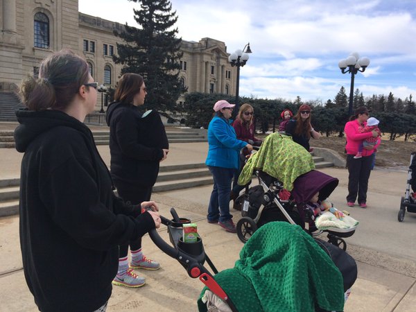 Families outside legislative building in "March for Midwives" walk.