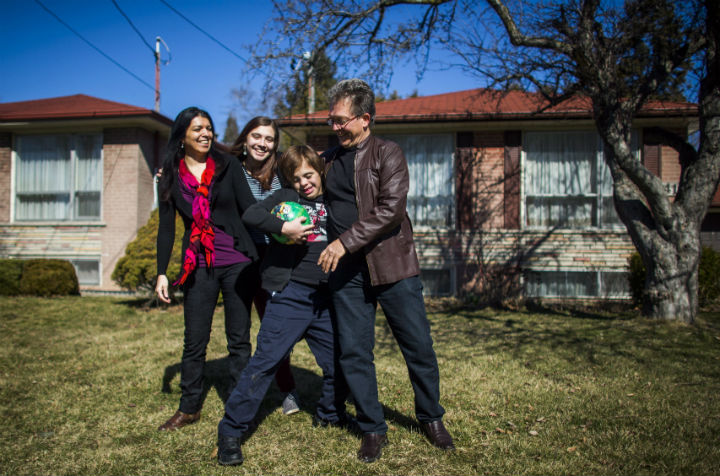 Nico Montoya, a 13-year-old boy with Down syndrome, plays soccer with his home with his father Felipe, right, his sister Tania, second left, and his mother Alejandra Garcia, left, at their home in Richmond Hill, Ont., on Saturday, March 19, 2016. 