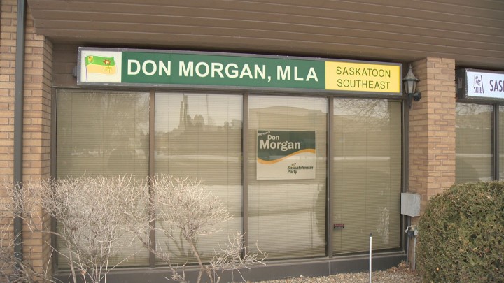 A re-elect Don Morgan sign is placed beneath the permanent sign for the education minister's constituency office, but Morgan said he's done nothing wrong.