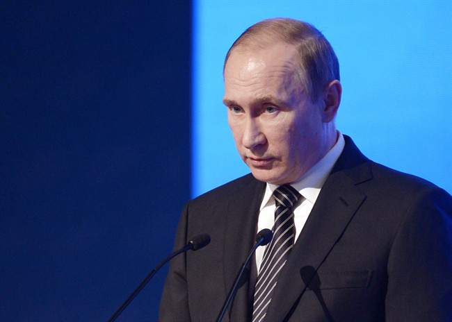 Russian President Vladimir Putin speaks at a meeting of the Russian Chamber of Commerce in Moscow, Russia, Tuesday, March 1, 2016. Russian officials say the U.N. human rights office in Moscow is closing.