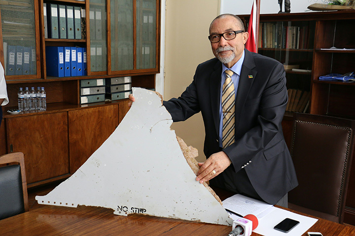 Joao de Abreu, President of Mozambique’s Civil Aviation Institute (IACM), holds a piece of suspected aircraft wreckage found off the east African coast of Mozambique on March 3, 2016.