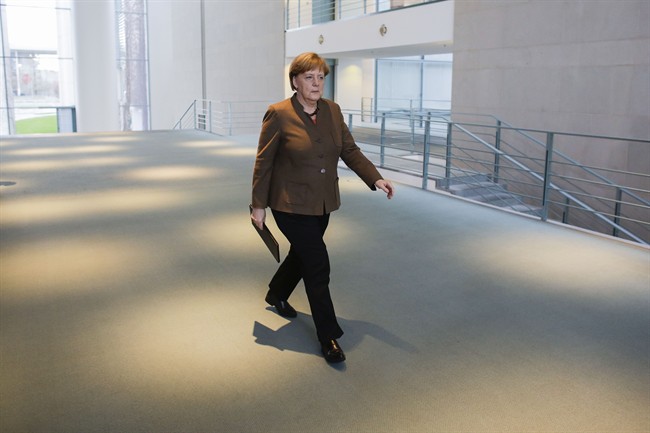 German Chancellor Angela Merkel arrives for a statement on the attacks in Brussels at the chancellery in Berlin, Germany, Tuesday, March 22, 2016. 