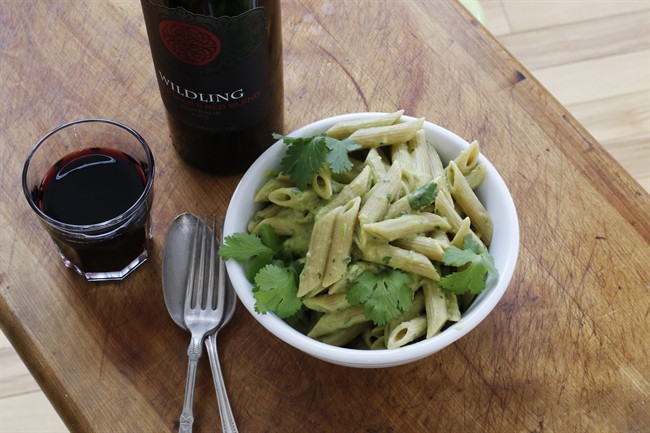 Pasta with speedy no-cook avocado sauce and fresh cilantro.