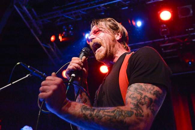 Singer Jesse Hughes, pictured Feb. 13, 2016, is apologizing for suggesting that security guards at a Paris concert venue were complicit in the assault by Islamic militants there in November that left 89 people dead. 