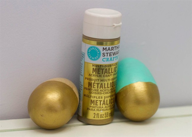 This Wednesday, March 9, 2016, photo shows two wooden Easter eggs decorated using acrylic paint. This was the most inexpensive of the three tested techniques but required multiple coats of paint to achieve opaque coverage.