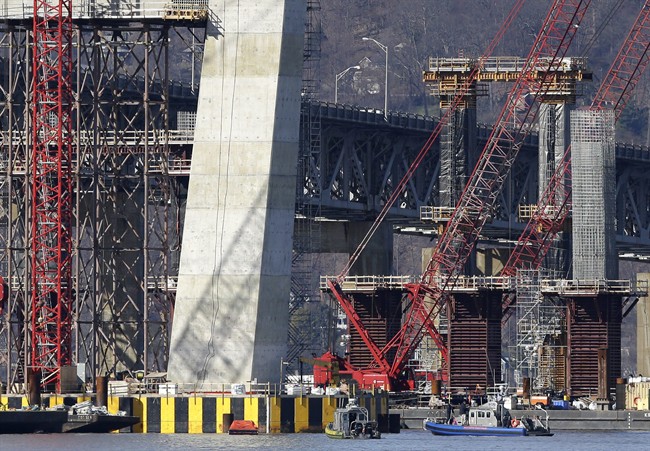 Boats of emergency officials work near the site of a fatal collision in the water underneath the Tappan Zee Bridge in Tarrytown, N.Y., Saturday, March 12, 2016. 
