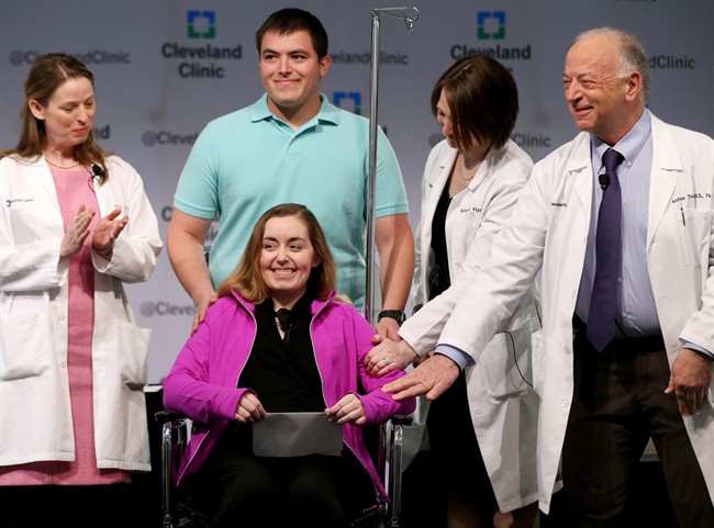 Lindsey and her husband Blake stand with Cleveland Clinic medical staff as they announce she was the nation's first uterus transplant patient, Monday, March 7, 2016, in Cleveland.