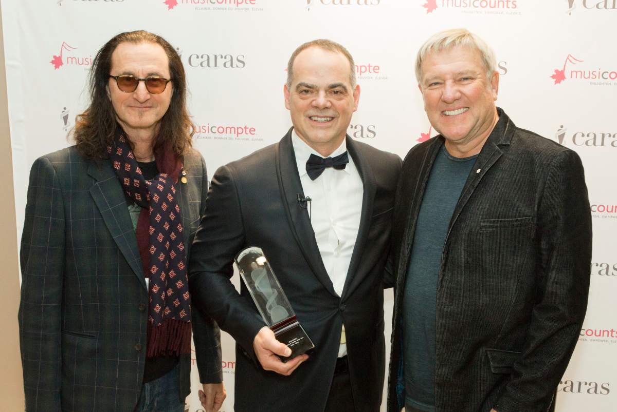 Don Bossé, centre, is seen here with Rush’s Geddy Lee and Alex Lifeson.