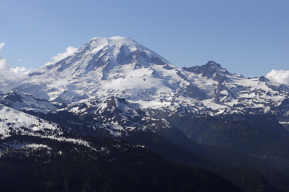 In this file photo taken June 19, 2013, Mount Rainier is seen from a helicopter flying south of the mountain and west of Yakima, Wash.