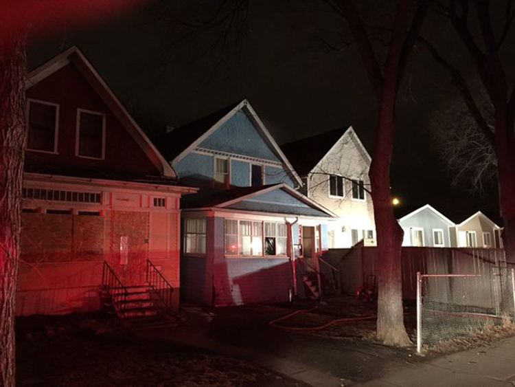 Regina fire crews battled an early morning house fire in Regina's cathedral neighbourhood on Tuesday.