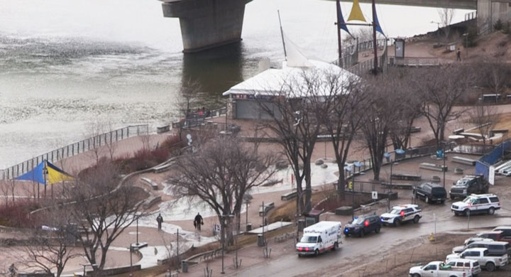 A Saskatoon police officer entered the icy South Saskatchewan River Wednesday afternoon to rescue a woman.
