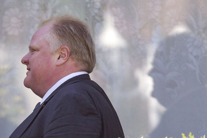 Rob Ford leaves his home on Friday May 17, 2013, after published reports said a video appears to show Ford smoking crack cocaine (THE CANADIAN PRESS/Chris Young).