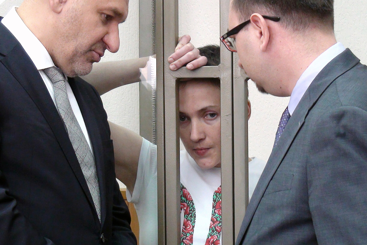 Ukrainian military pilot Nadiya Savchenko reacts inside a defendants' cage as she attends the verdict announcement at a court in the southern Russian town of Donetsk, on March 21, 2016. 