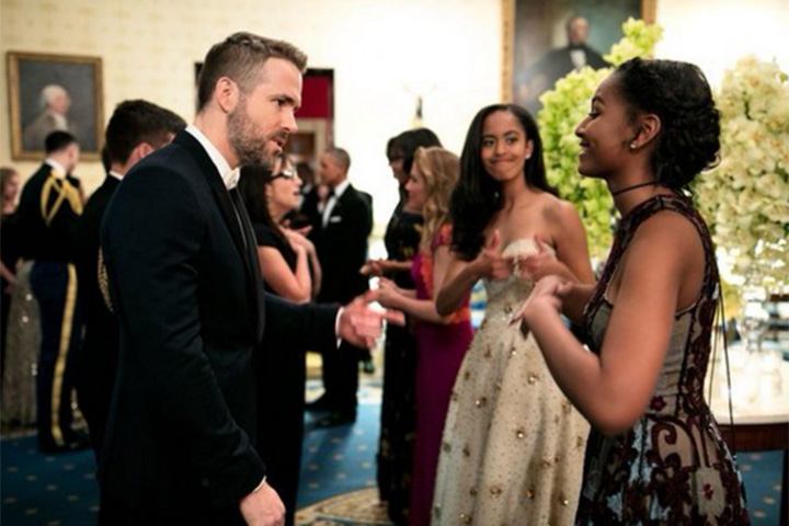Malia Obama is seen giving her sister, Sasha, a thumbs-up during a brief encounter with Canadian actor Ryan Reynolds.