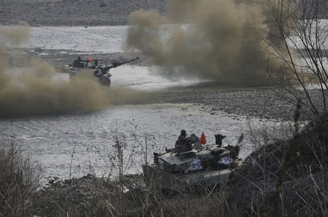 South Korean army K-1 tanks move during an annual exercise in Yeoncheon, near the border with North Korea, Thursday, March 3, 2016. North Korea fired six short-range projectiles into the sea off its east coast Thursday, Seoul officials said, just hours after the U.N. Security Council approved the toughest sanctions on Pyongyang in two decades for its recent nuclear test and long-range rocket launch. 