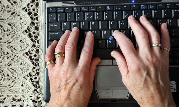 senior citizen on computer